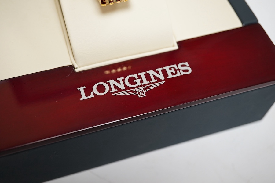 A lady's steel and gold plated Longines Le Grande Classique quartz wrist watch, white dial, case diameter 30mm, flexible link bracelet, boxed with papers.